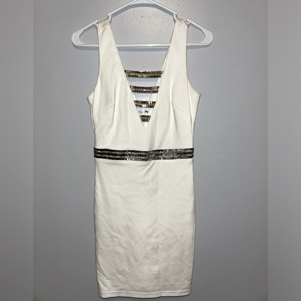Stunning, tight white dress with silver and gold beading by Bebe